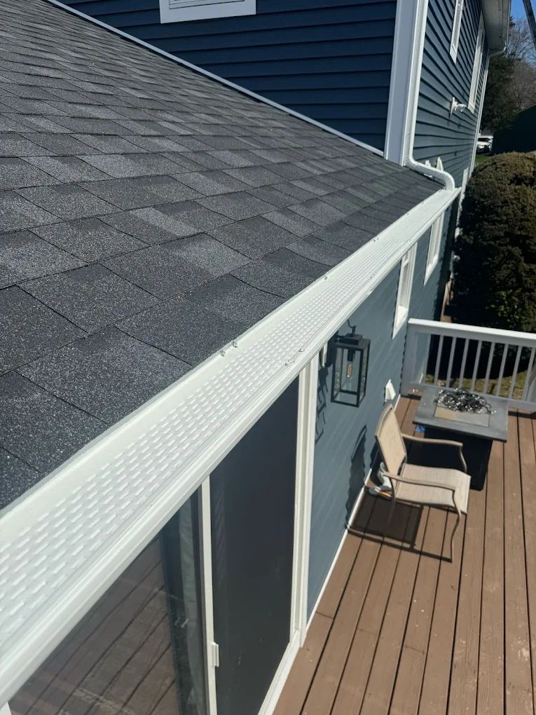 Gutter guard installed by Mr. Gutter along a roof edge