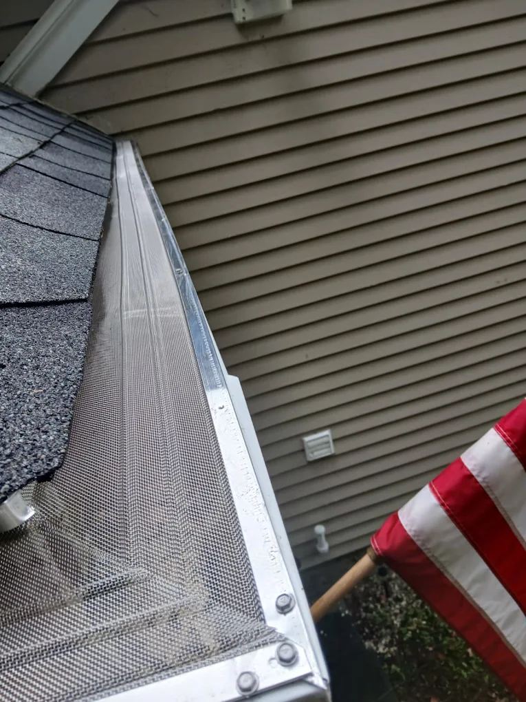 All Mesh Pro stainless steel mesh gutter guard on a roof edge