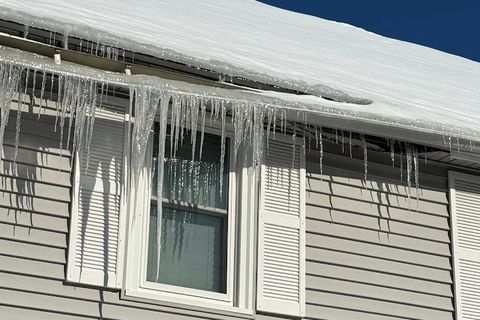Icicles hanging from a downspout